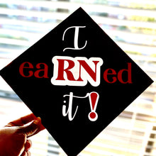 Load image into Gallery viewer, Teekajame Creations black nursing graduation cap topper featuring white and red I eaRNed It text for nurse graduates.
